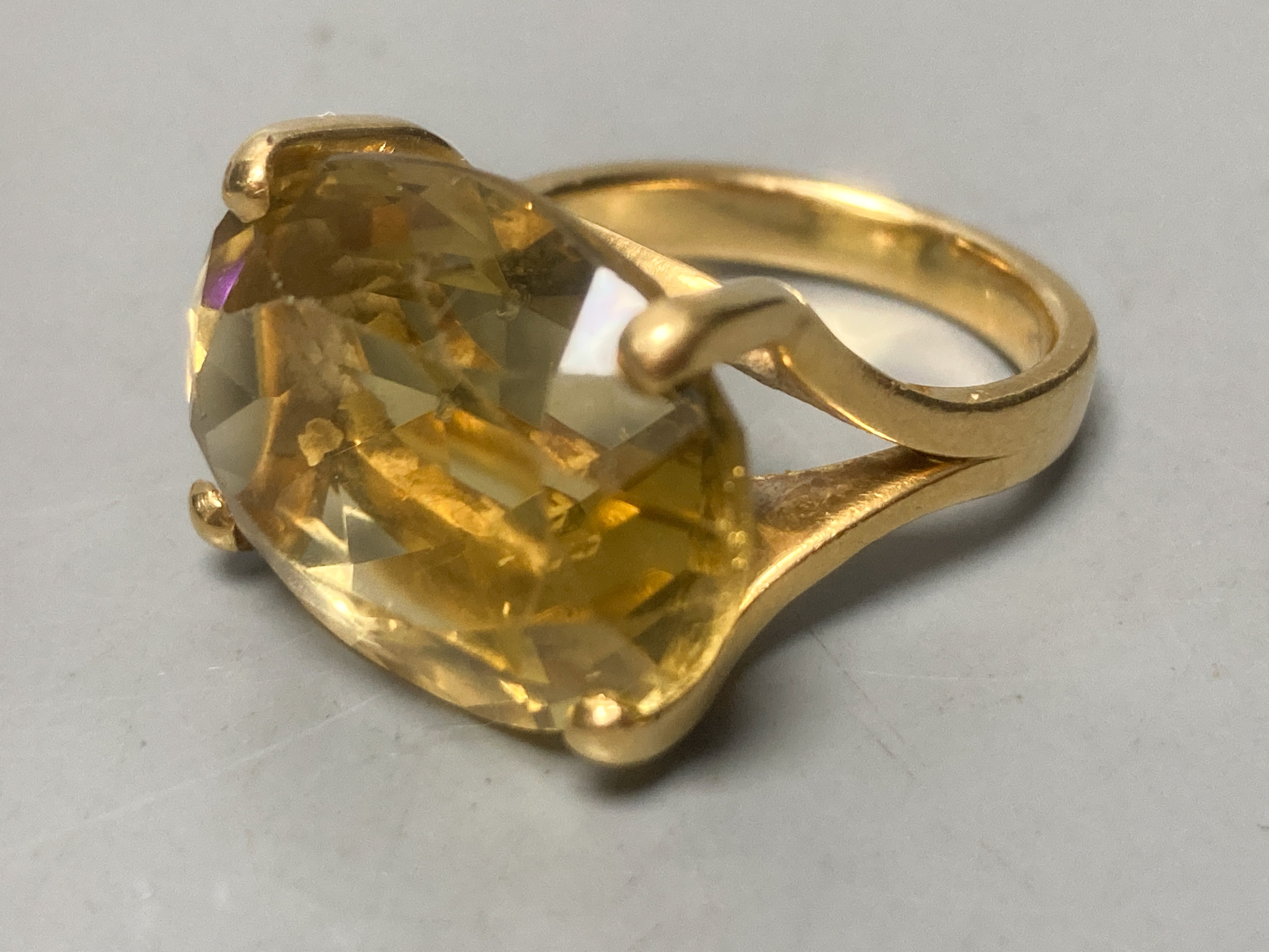 A Victorian 15ct gold buckle ring, size P/Q, 4.2 grams, three yellow metal and gem set dress rings, including amethyst, citrine and green tourmaline, gross 21.1 grams, an 18k deity pendant, 3.1 grams and a white metal an